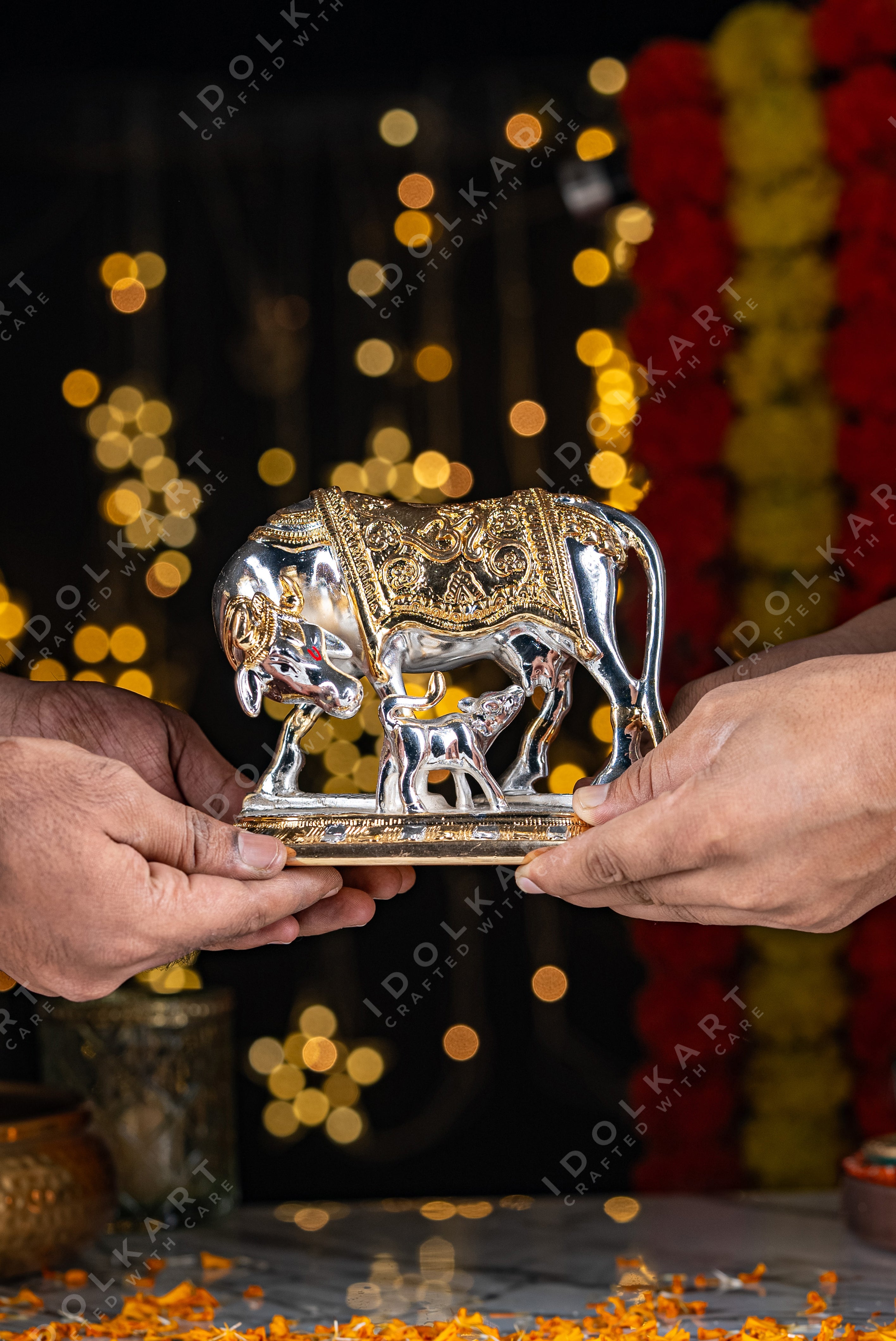 Gold Silver Coated Kamadhenu Idol in hand
