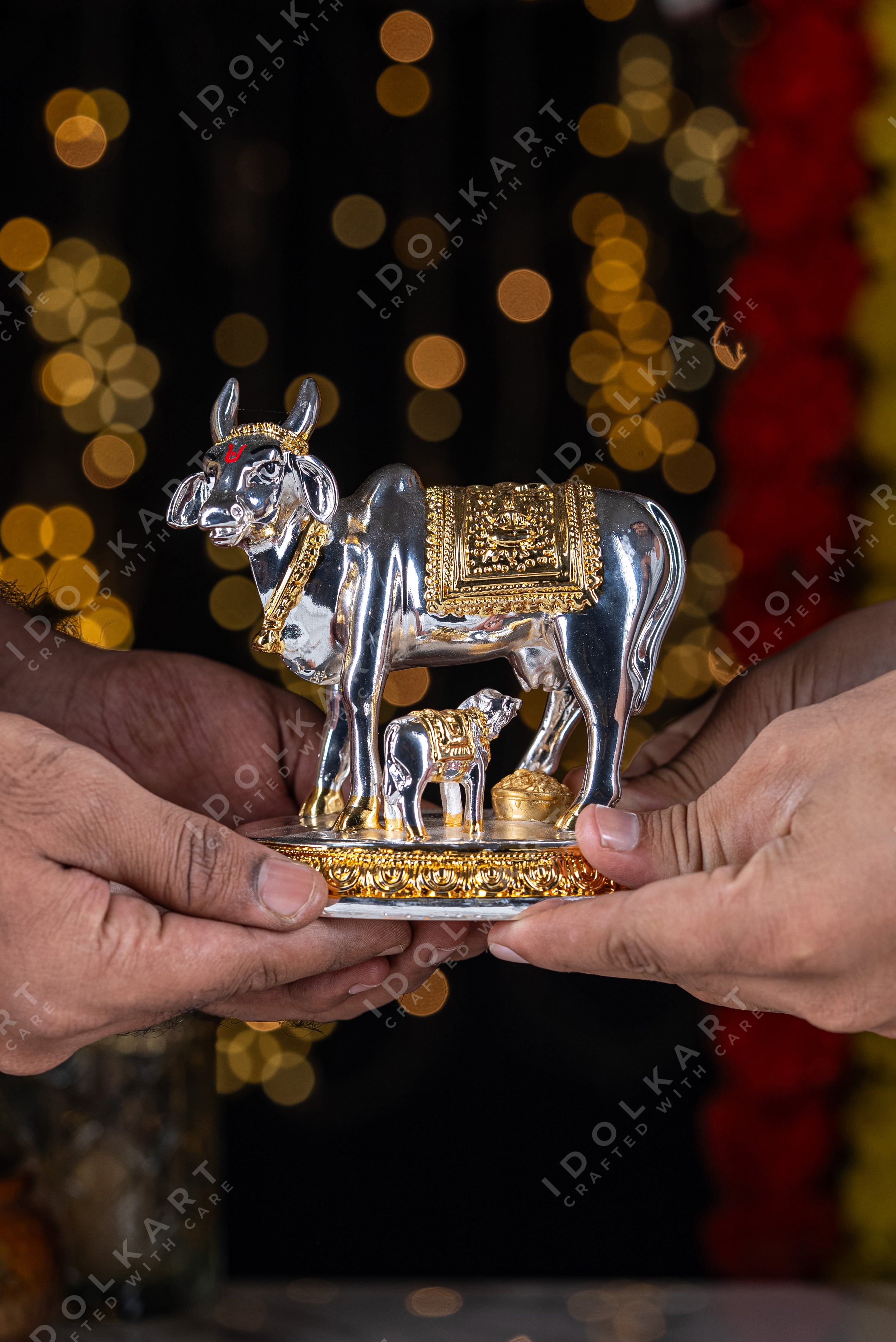 Kamadhenu idol in hand