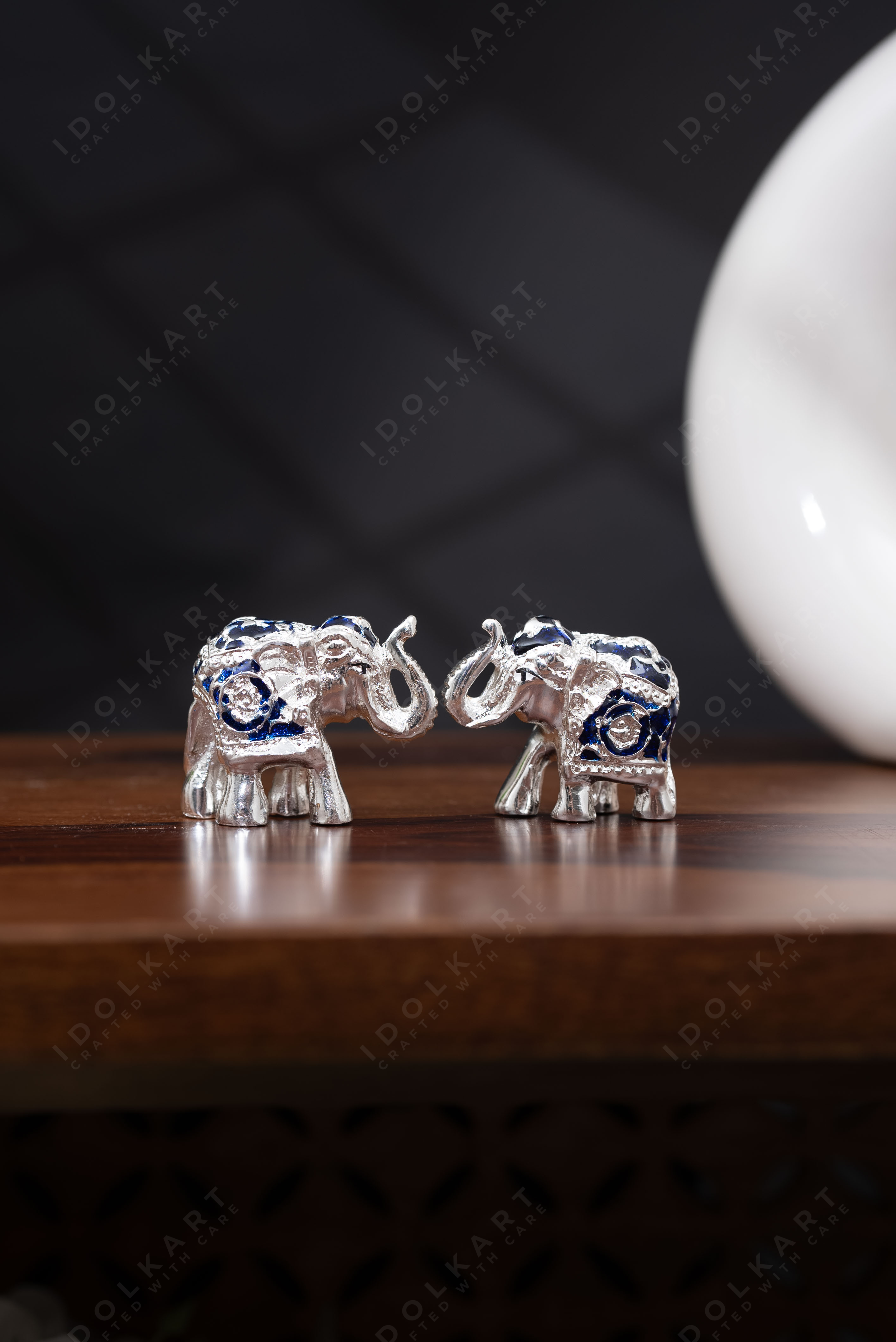 silver blue elephant on table 